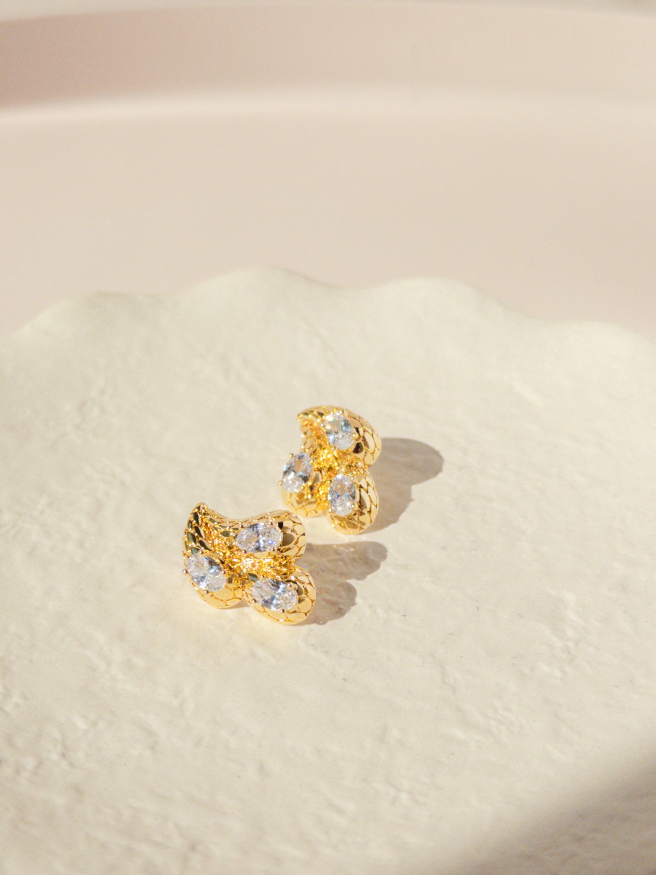 A pair of gold drop crystal earrings with intricate gold detailing, Jewelry Malta by Sarah Gauci
