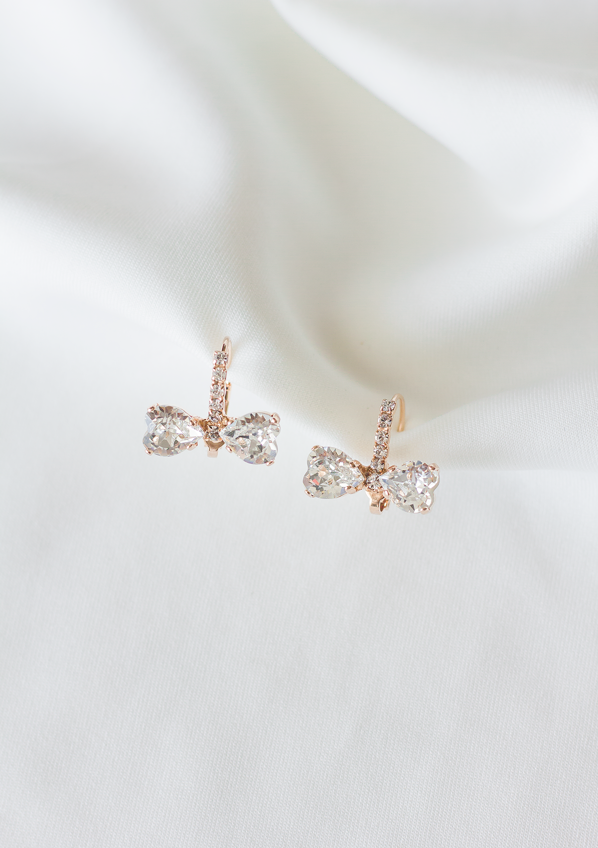 Marie Bow earrings, jewelry designed and made by Sarah Gauci in Malta. Rose Gold Plating.