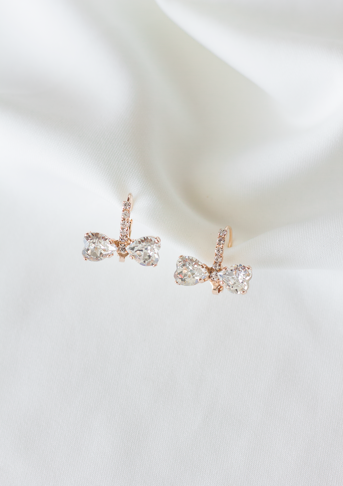 Marie Bow earrings, jewelry designed and made by Sarah Gauci in Malta. Rose Gold Plating. 