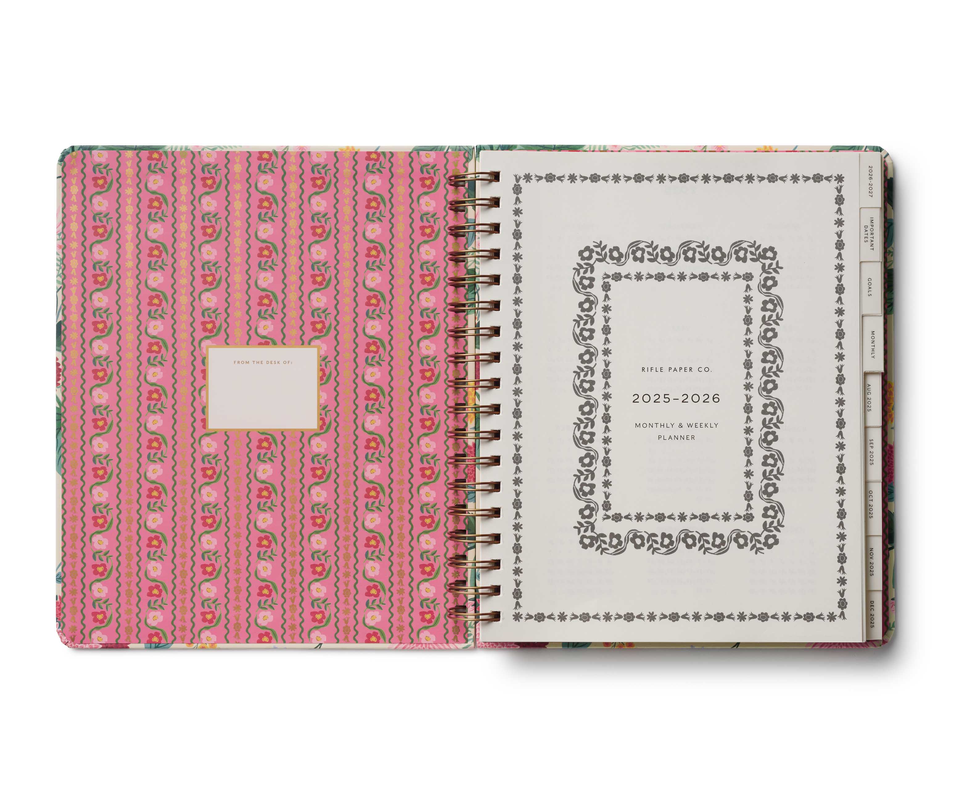 Planner with pink patterned cover and white front cover displaying text