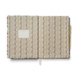 Patterned notebook with a gold clip on a white background Stationery Malta