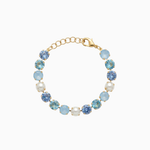 Bracelet with blue and gold beads on a white background