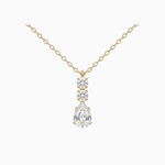 Gold necklace with a teardrop-shaped diamond pendant on a white background