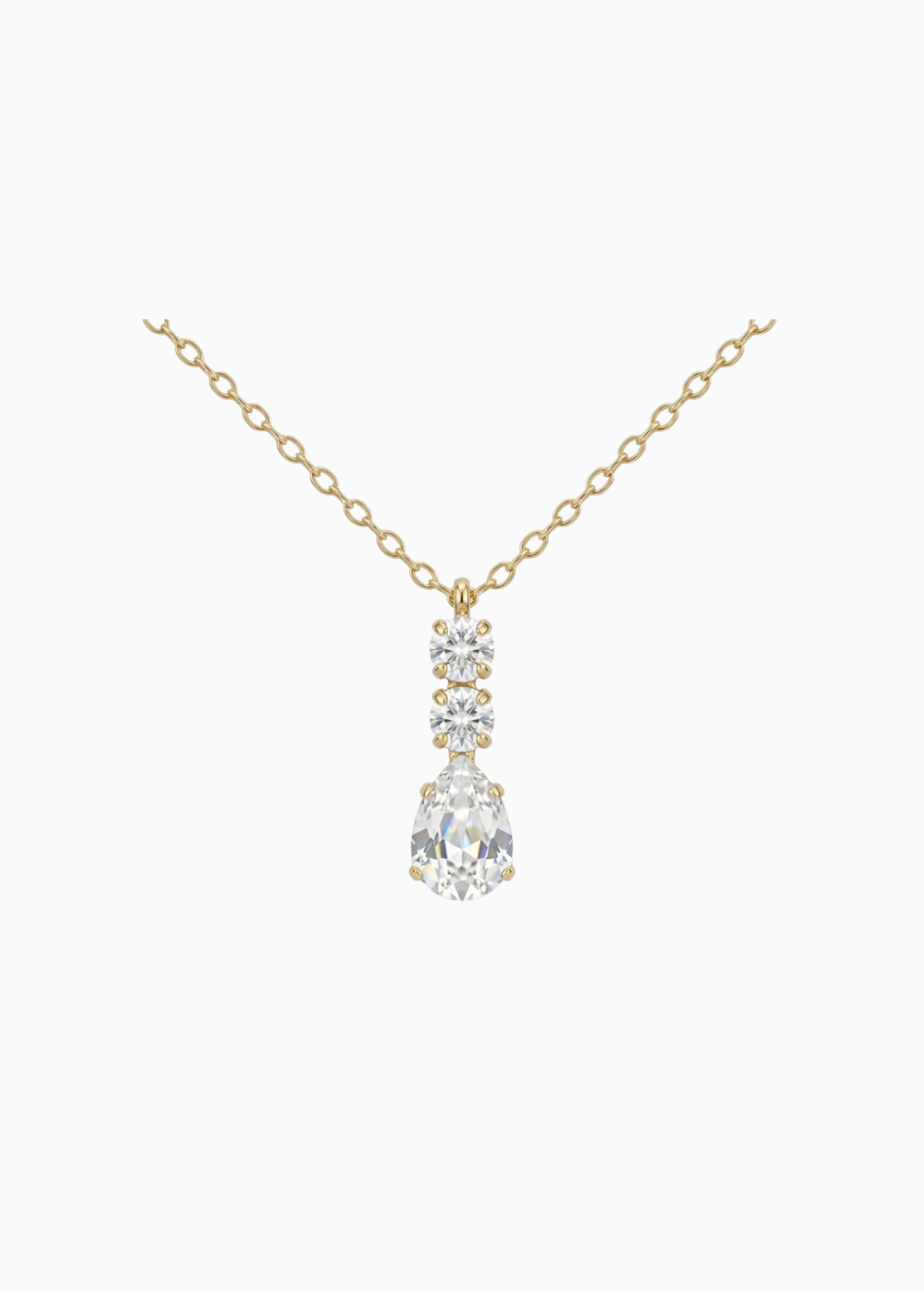Gold necklace with a teardrop-shaped diamond pendant on a white background