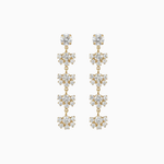 Pair of gold and crystal drop earrings on a white background