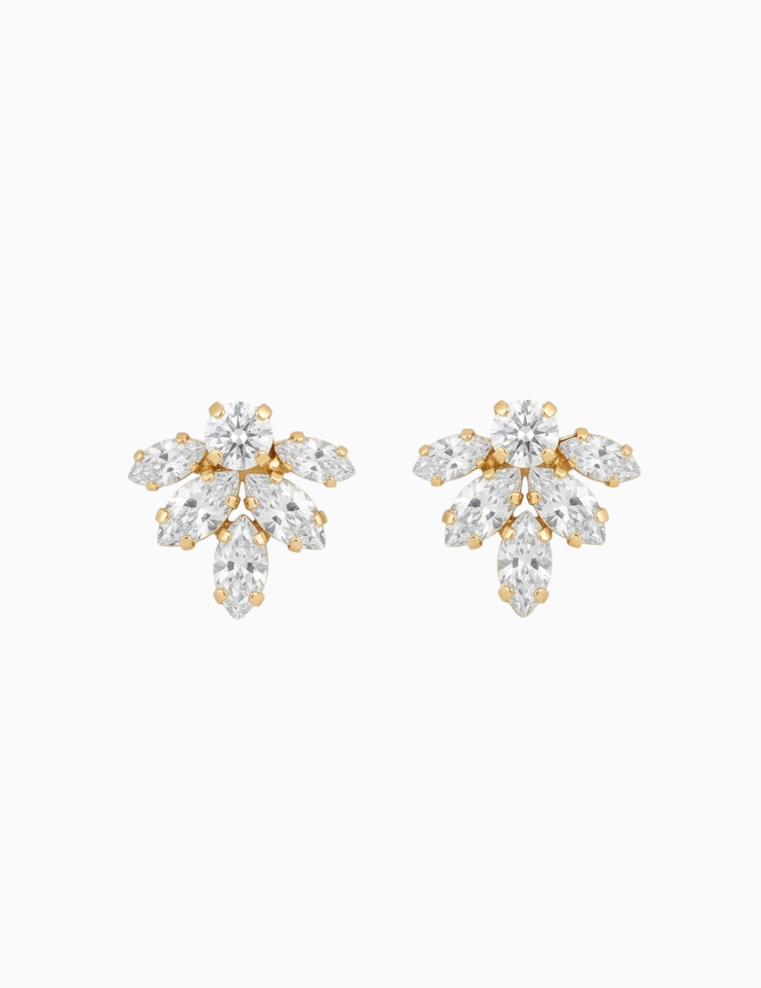 Pair of gold and crystal earrings on a white background