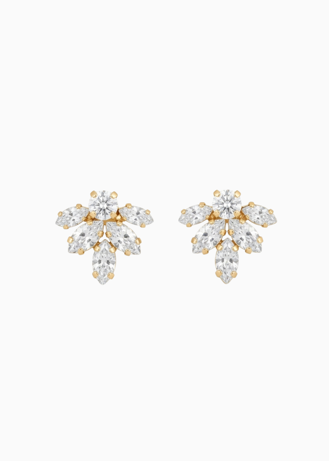 Pair of gold and crystal earrings on a white background