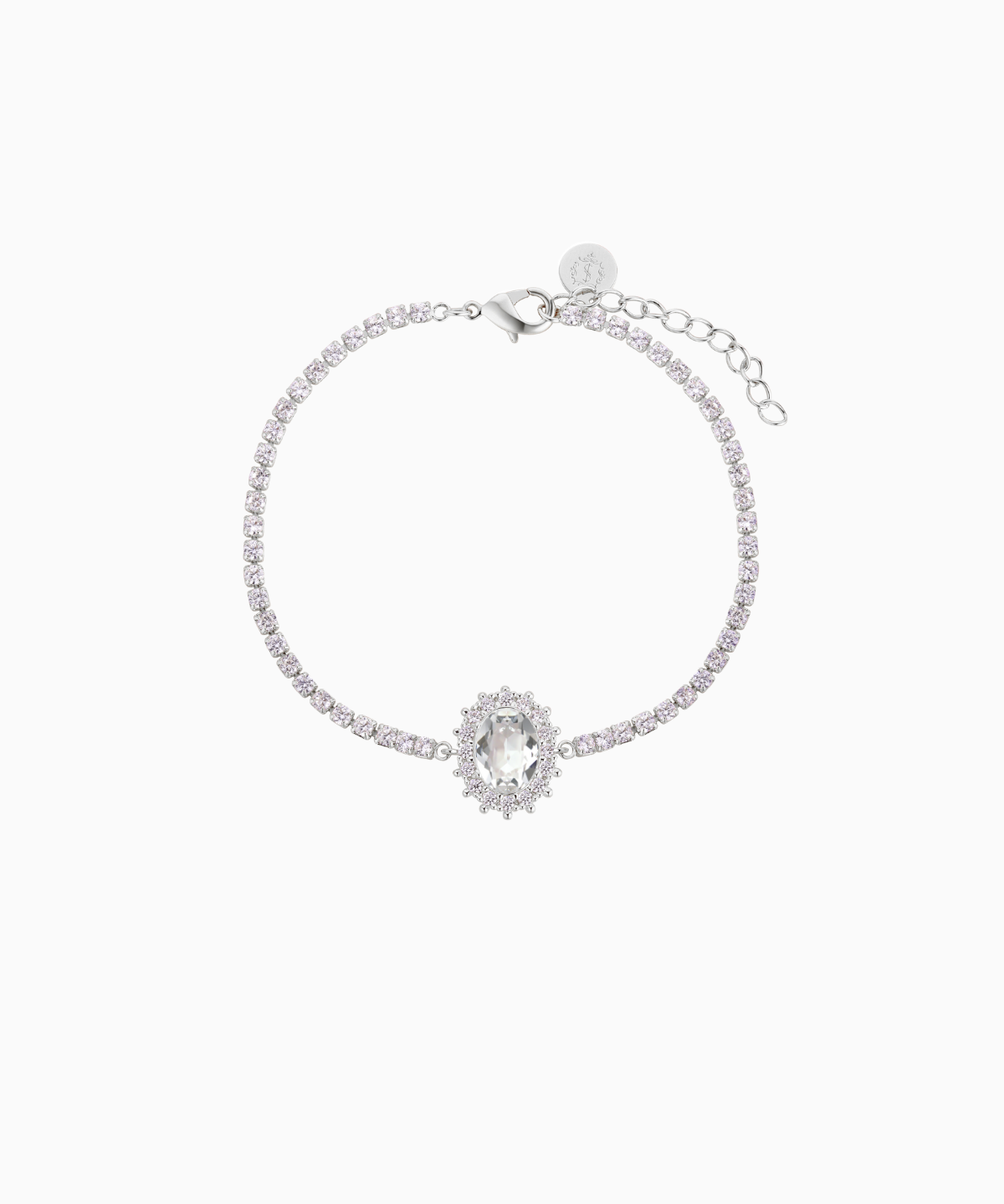 A rhodium-plated brass bracelet with a chain extension, featuring shimmering crystals arranged in an oval halo design by Sarah Gauci