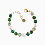 Bracelet with green and clear gemstones on a white background