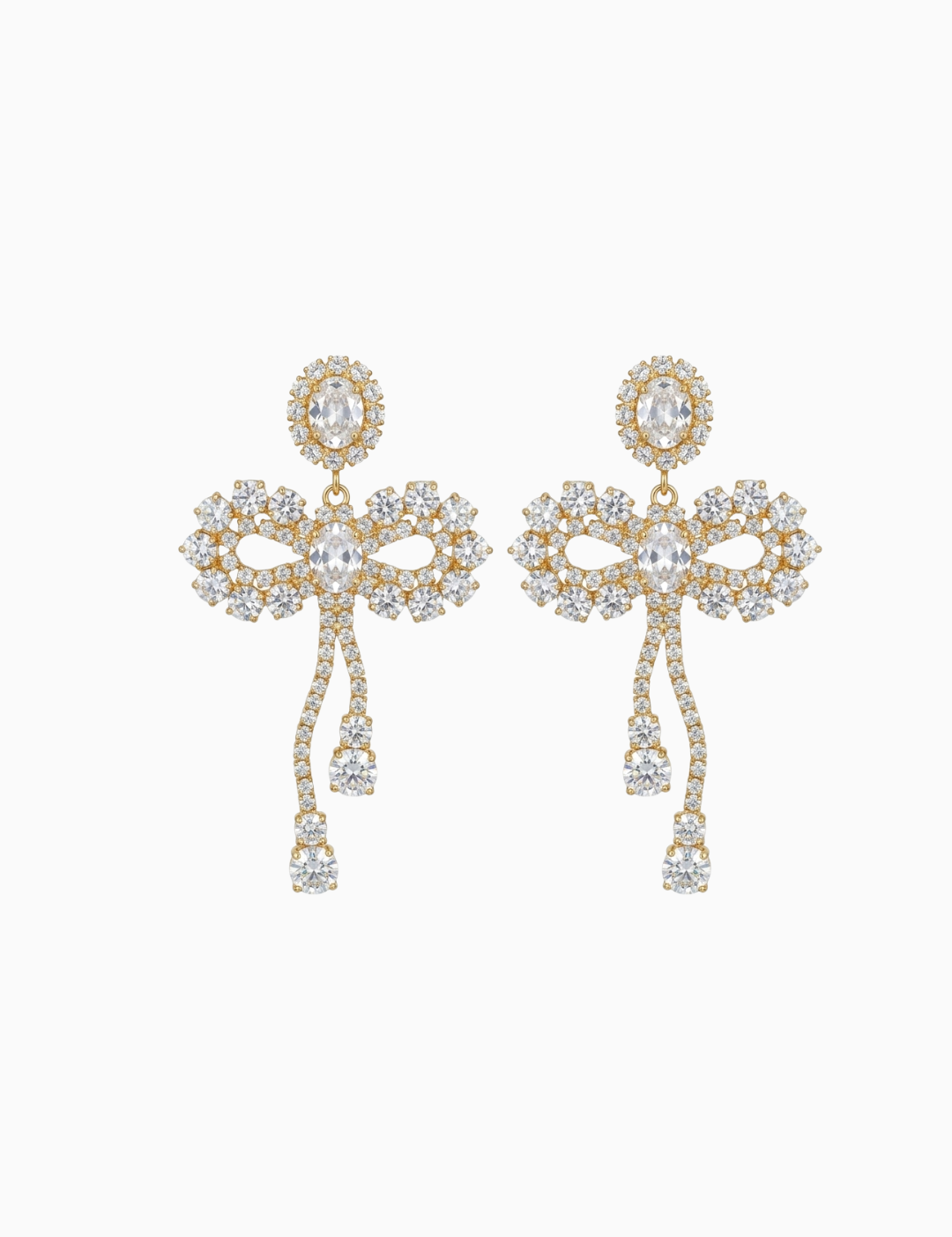 Pair of gold and crystal earrings on a white background
