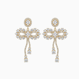 Pair of gold and crystal earrings on a white background