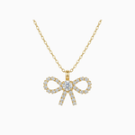 Gold bow-shaped necklace with diamonds on a white background