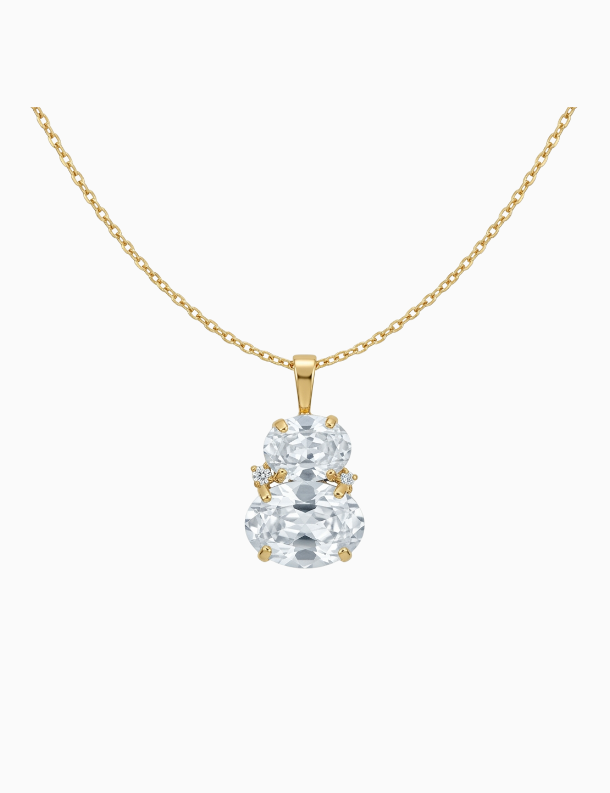 Gold necklace with a clear gemstone pendant on a white background