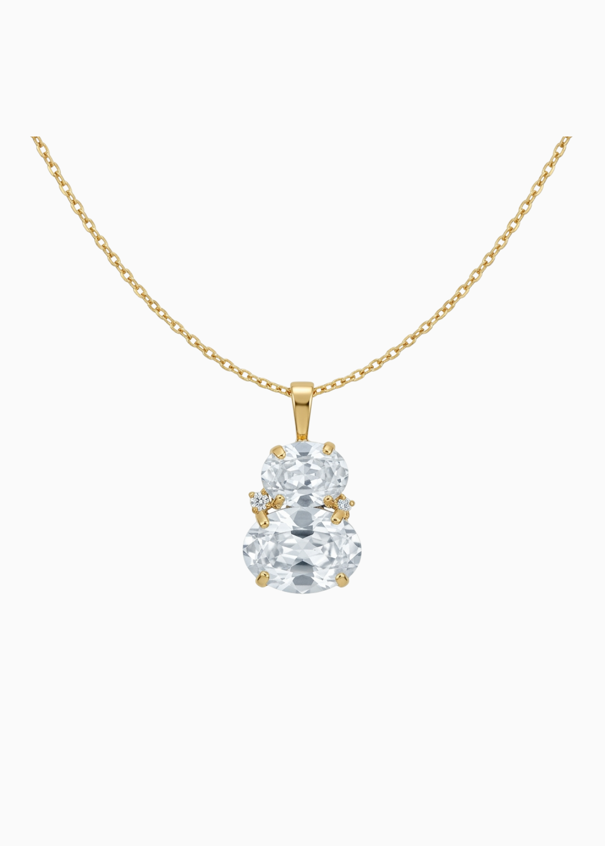 Gold necklace with a clear gemstone pendant on a white background