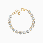 Gold bracelet with clear gemstones on a white background