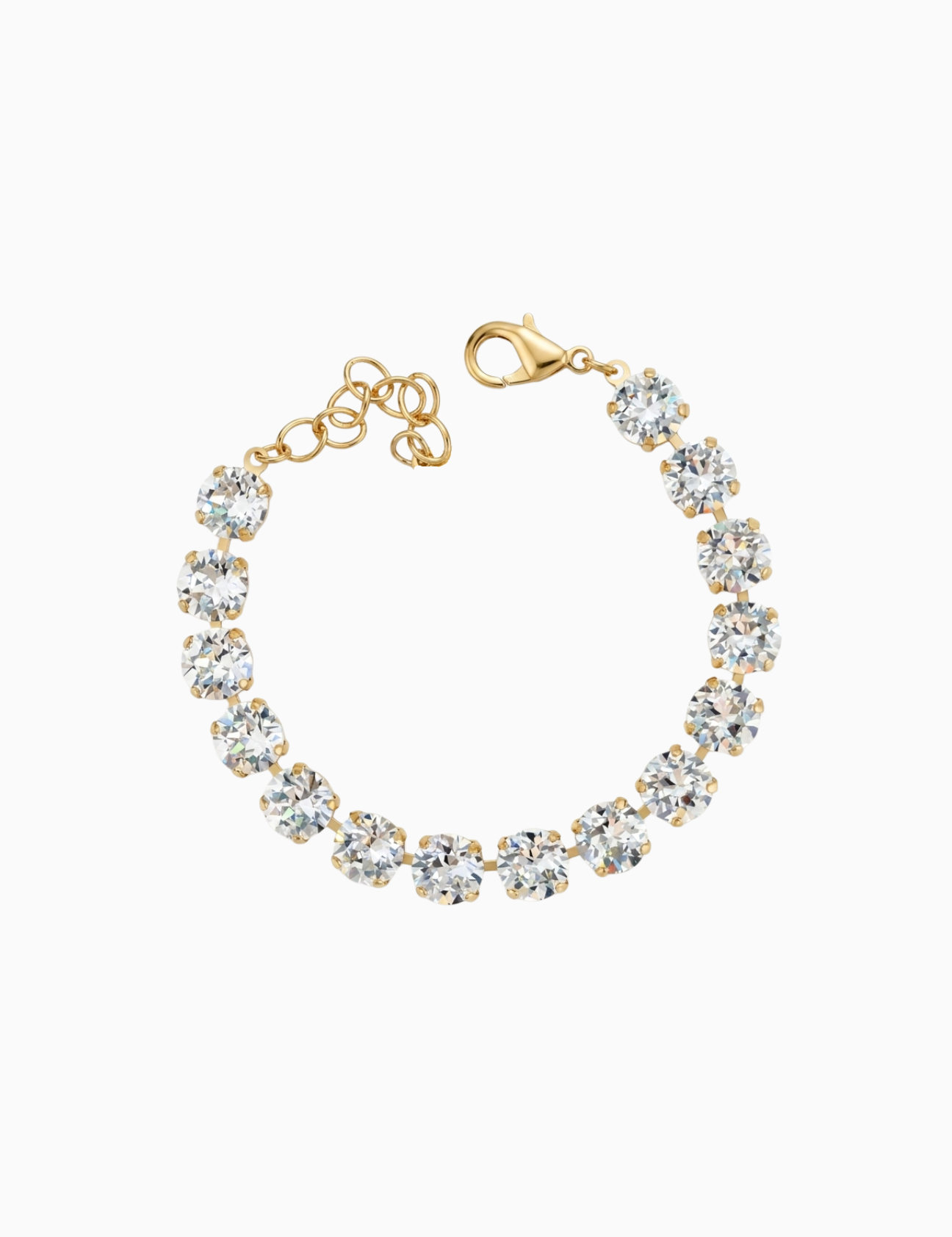 Gold bracelet with clear gemstones on a white background