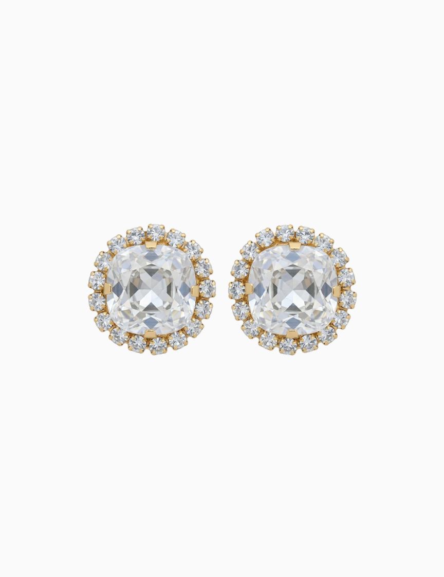 Pair of gold and clear crystal stud earrings on a white background