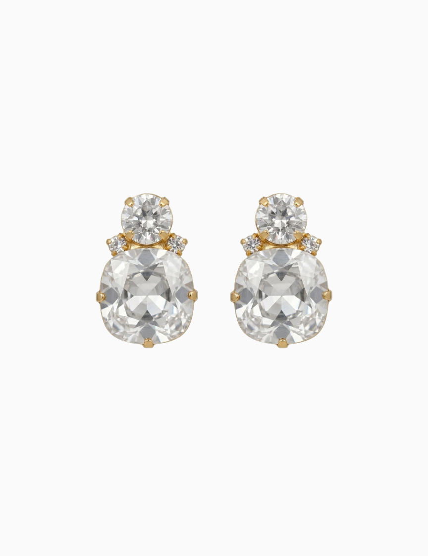 Pair of gold and crystal earrings on a white background