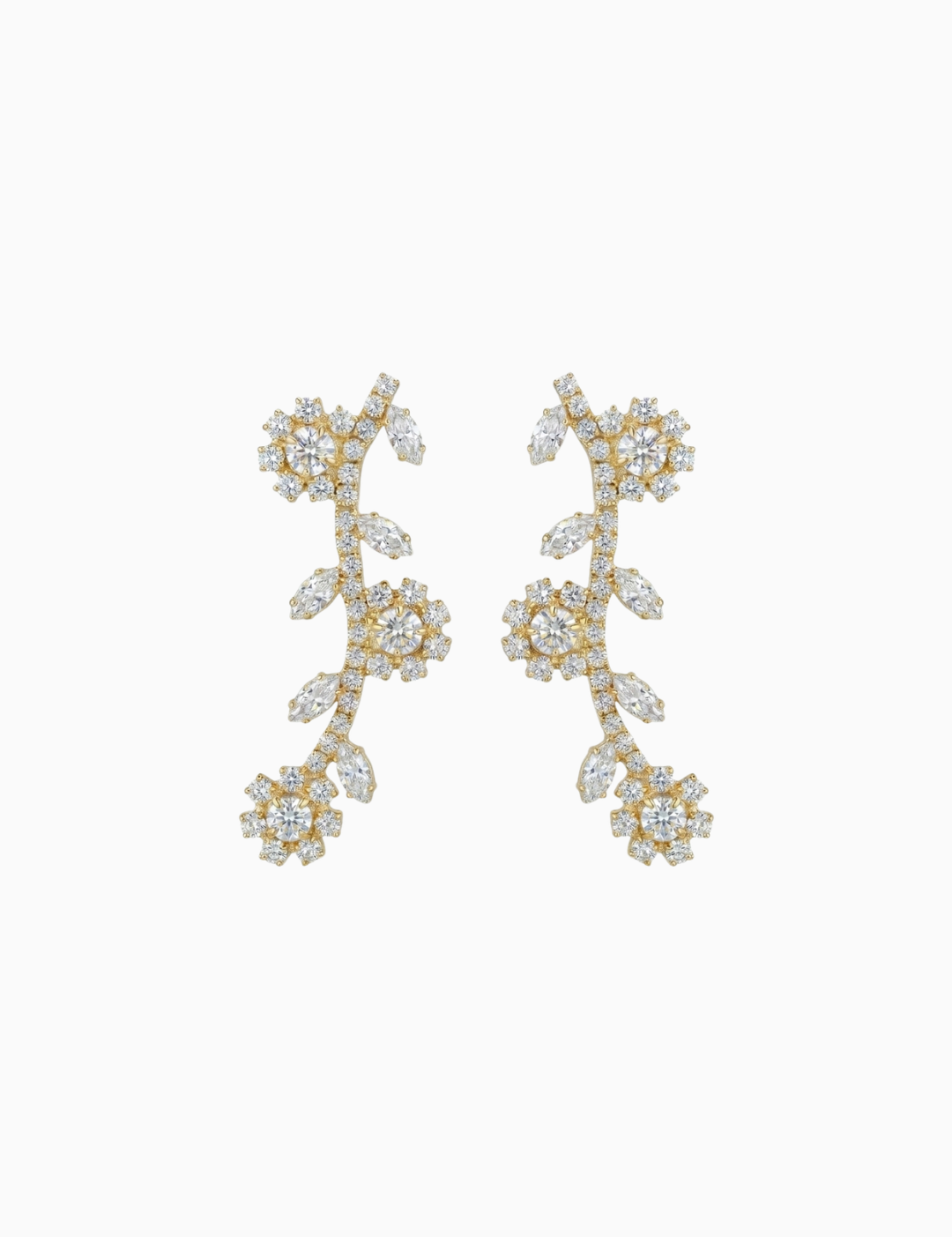 Pair of gold earrings with diamond-like stones on a white background