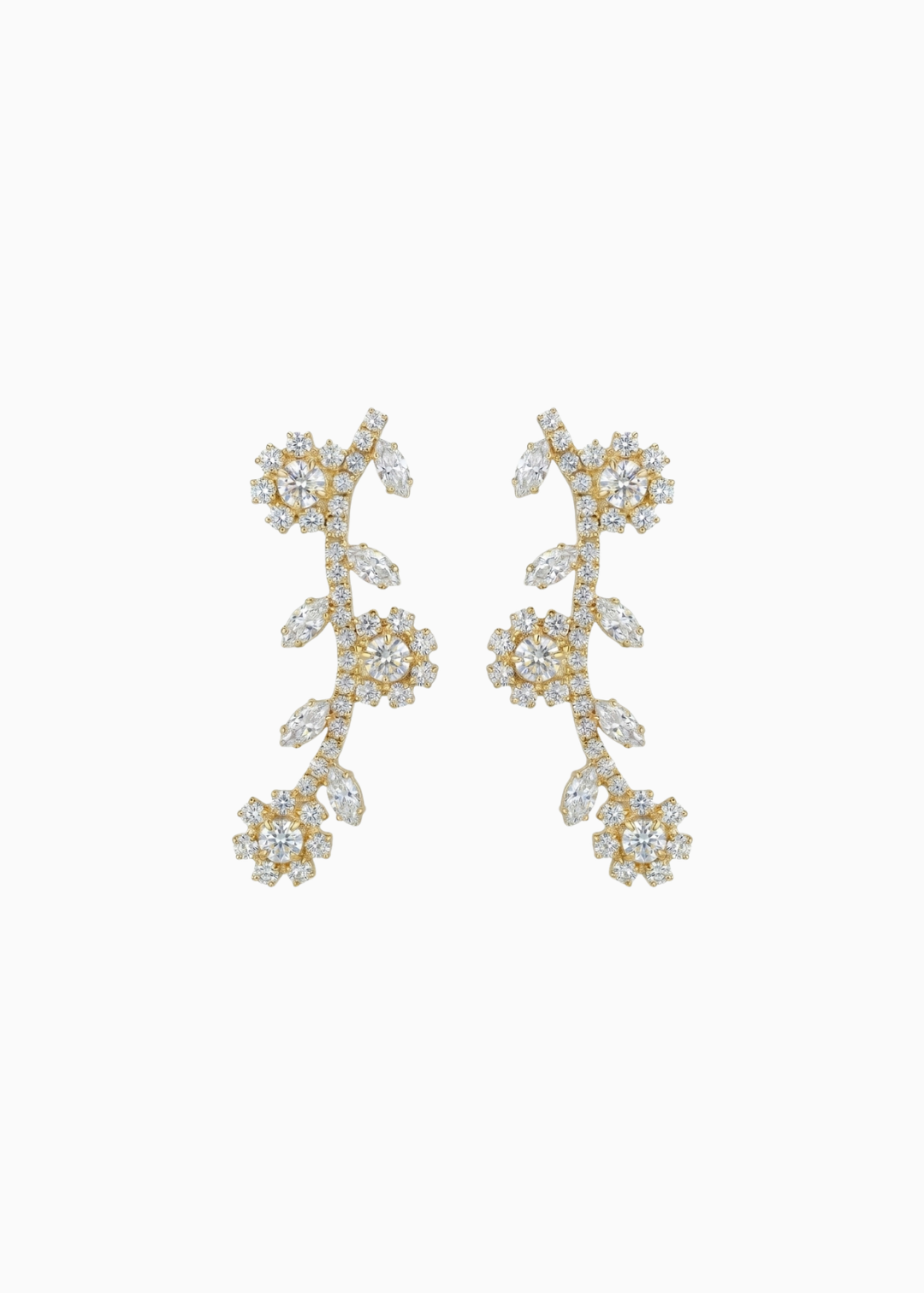 Pair of gold earrings with diamond-like stones on a white background