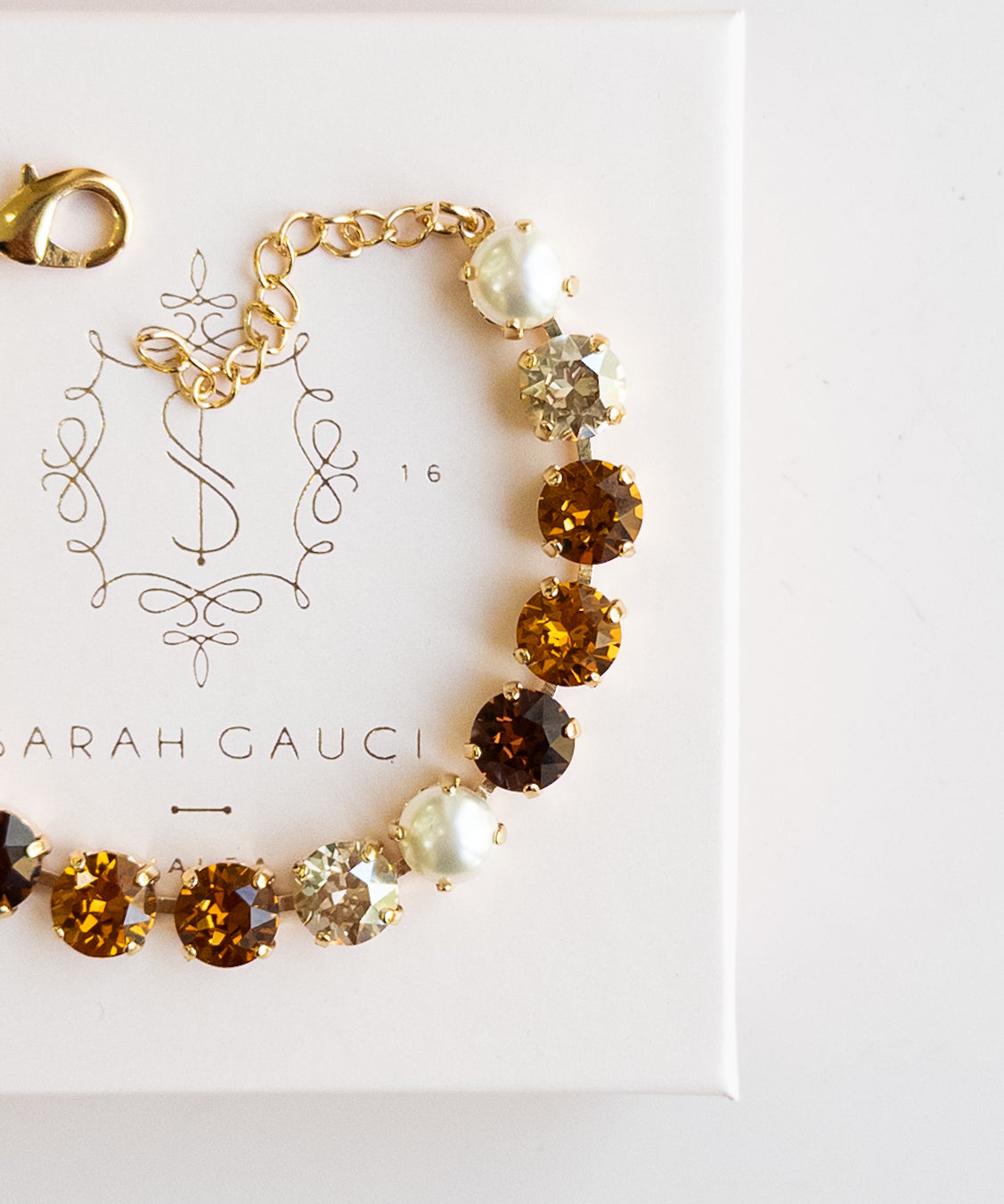 Gold bracelet with brown, Pearl and Autumn gemstones by Sarah Gauci