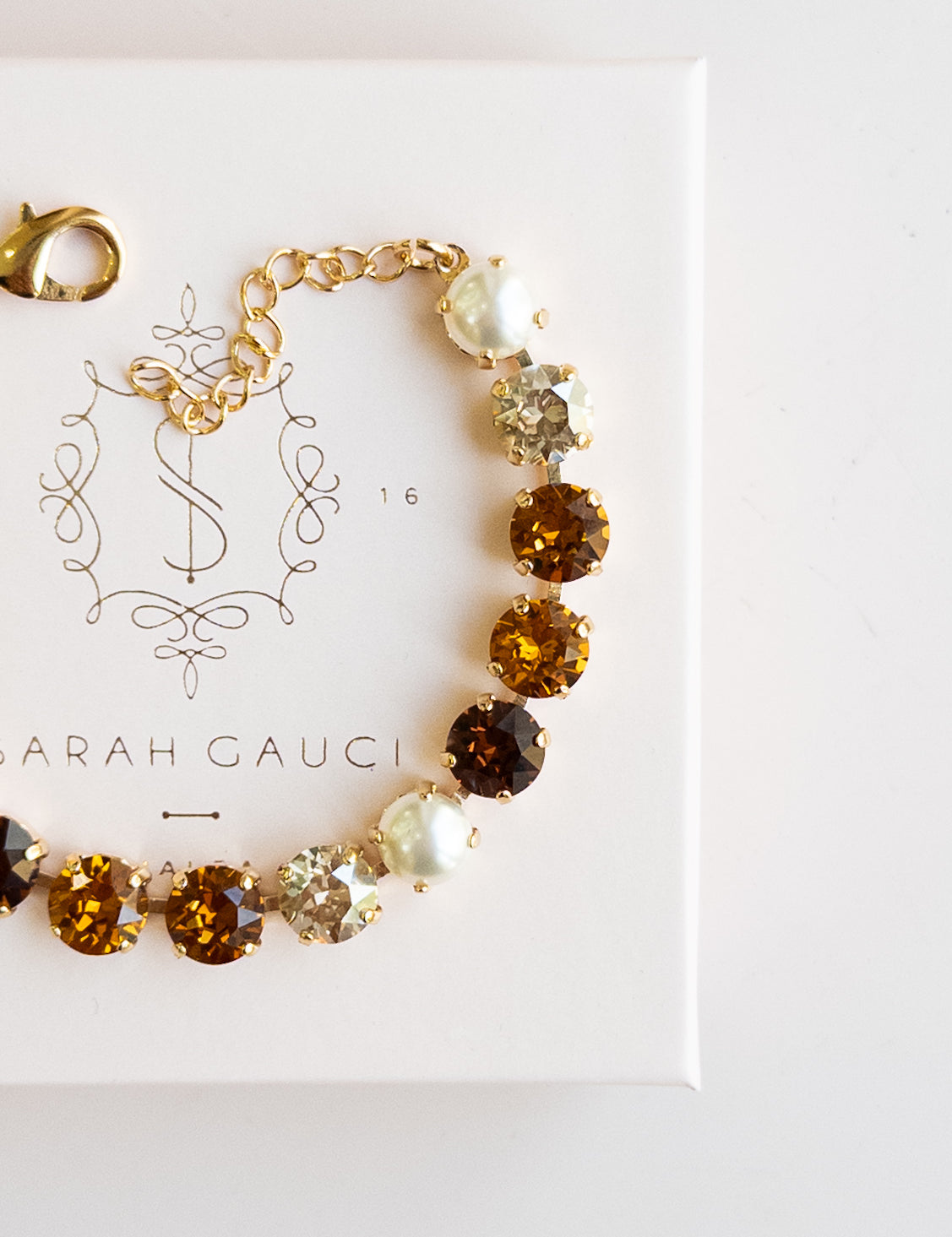 Gold bracelet with brown, Pearl and Autumn gemstones by Sarah Gauci