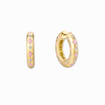 A pair of romantic blush pink enamel hoop earrings with sparkling crystals, and 18K gold plating.