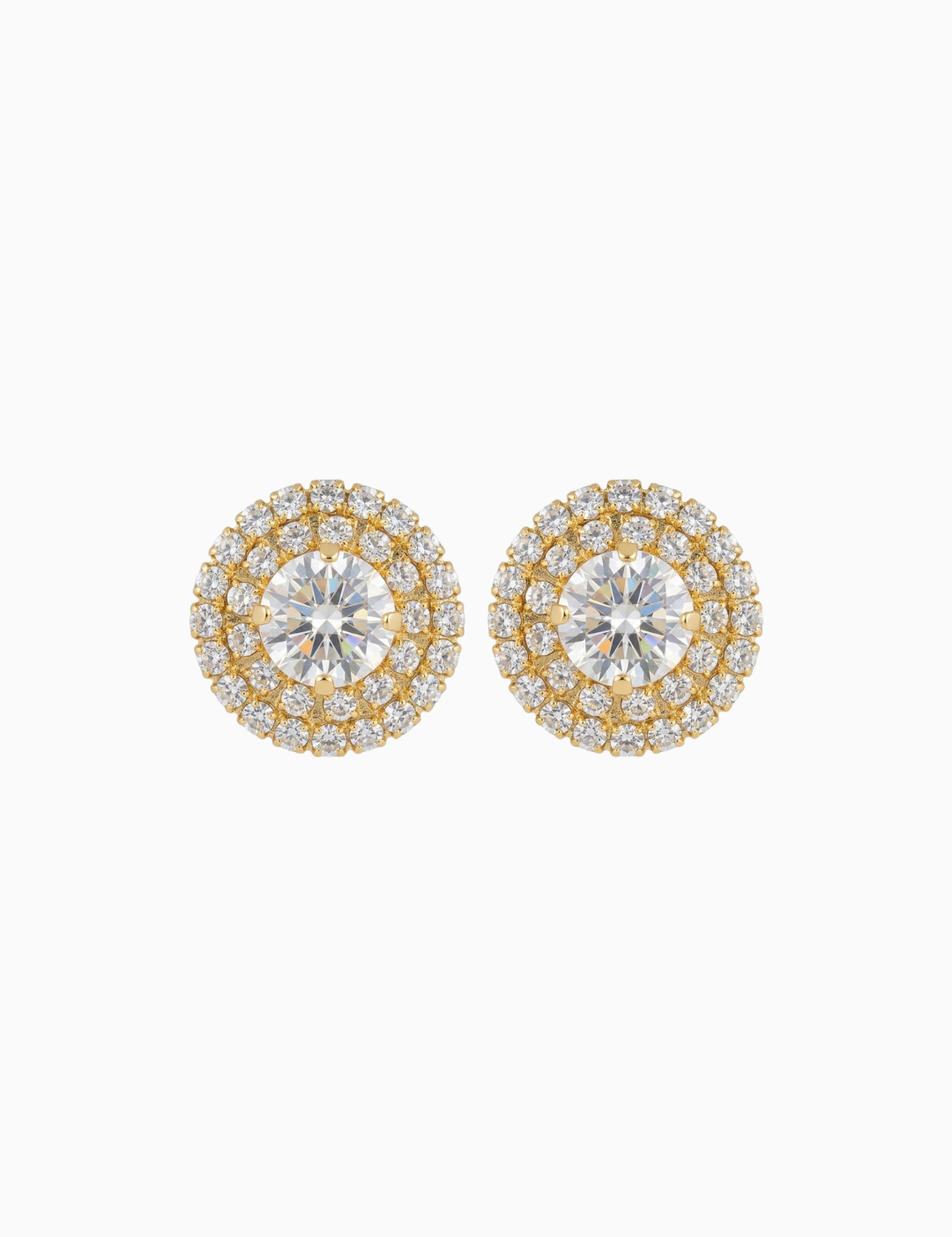 Pair of gold and silver round earrings on a white background