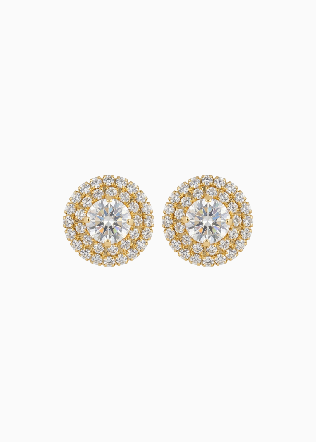 Pair of gold and silver round earrings on a white background