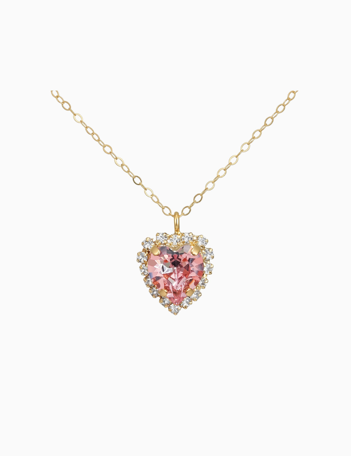 Gold necklace with a heart-shaped pink gemstone pendant on a white background