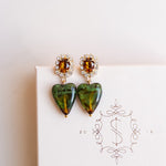 Heart-shaped earrings with green and brown stones by Sarah Gauci