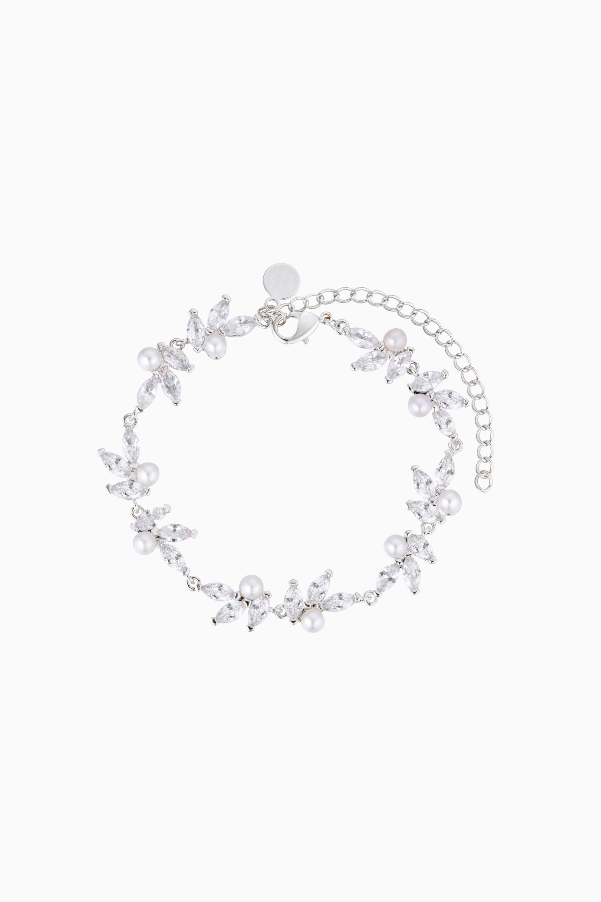 A rhodium-plated bracelet adorned with high-quality shimmering crystals and pearls, featuring a floral pattern and a chain extender.