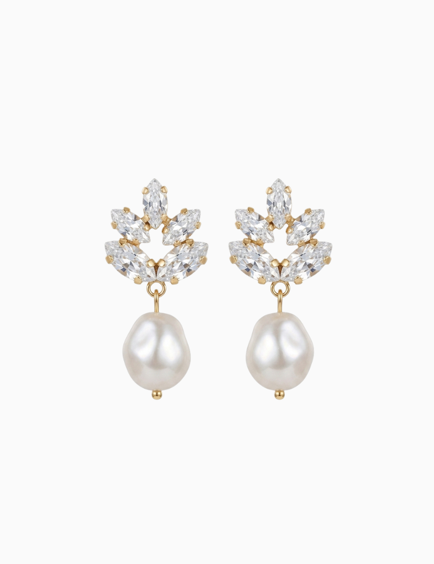 Pair of earrings with pearl drops and crystal accents on a white background