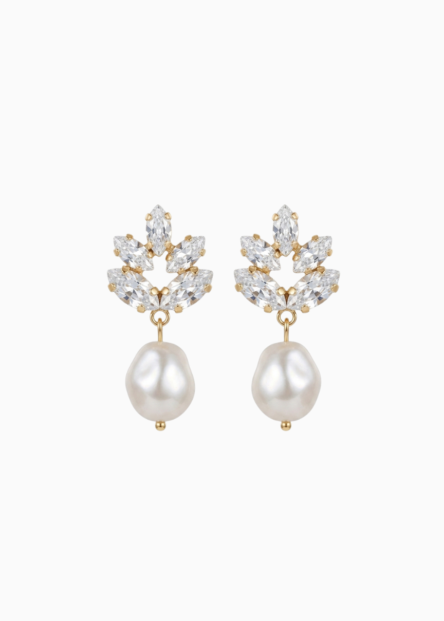 Pair of earrings with pearl drops and crystal accents on a white background