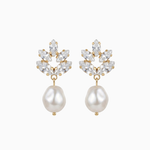 Pair of earrings with pearl drops and crystal accents on a white background