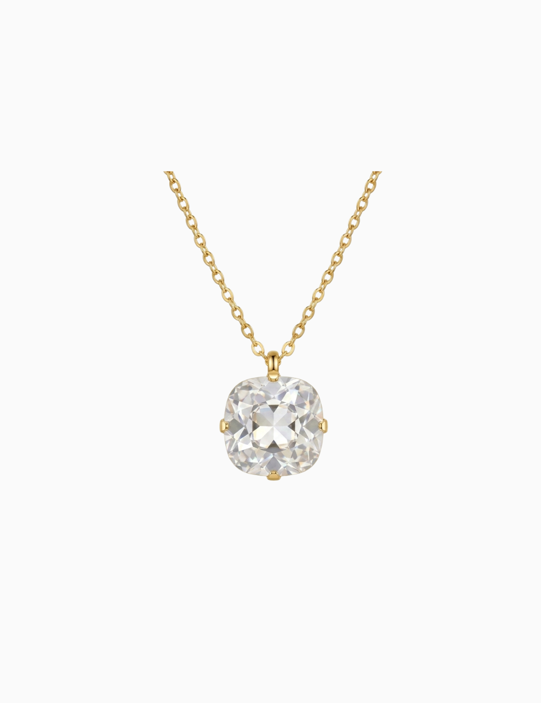 Gold necklace with a clear gemstone pendant on a white background