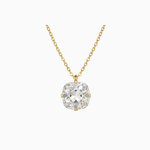 Gold necklace with a clear gemstone pendant on a white background
