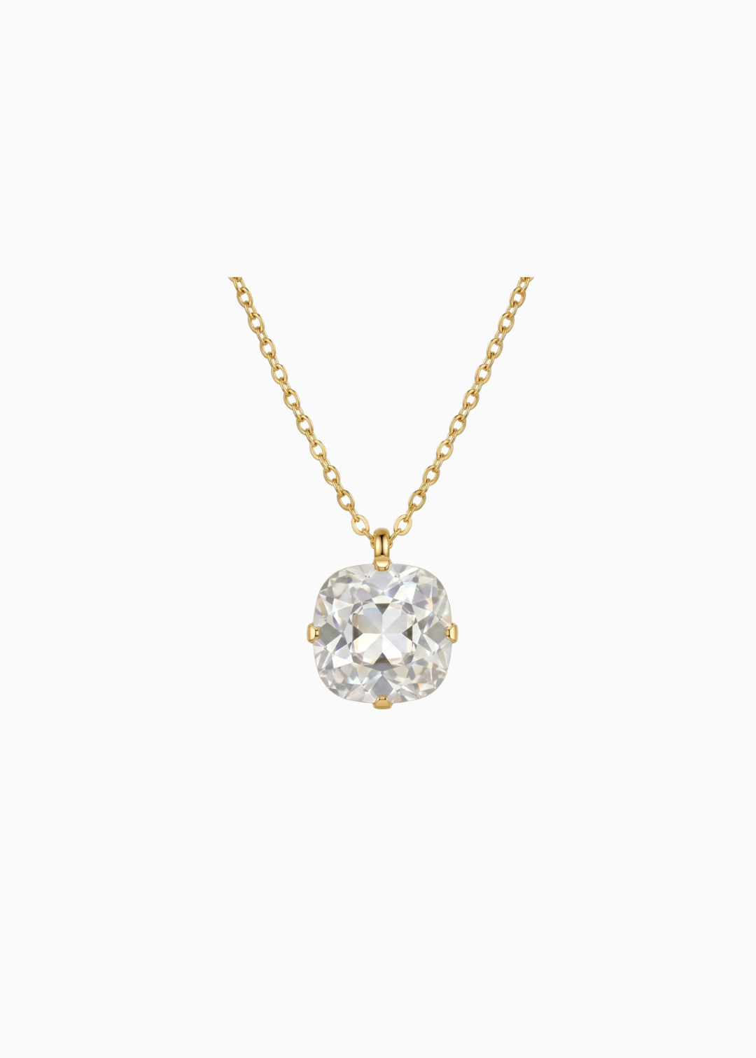 Gold necklace with a clear gemstone pendant on a white background