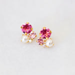 A pair of pink crystal and pearl stud earrings, with gold plating by Sarah Gauci Malta