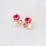 A pair of pink crystal and pearl stud earrings, with gold plating by Sarah Gauci Malta