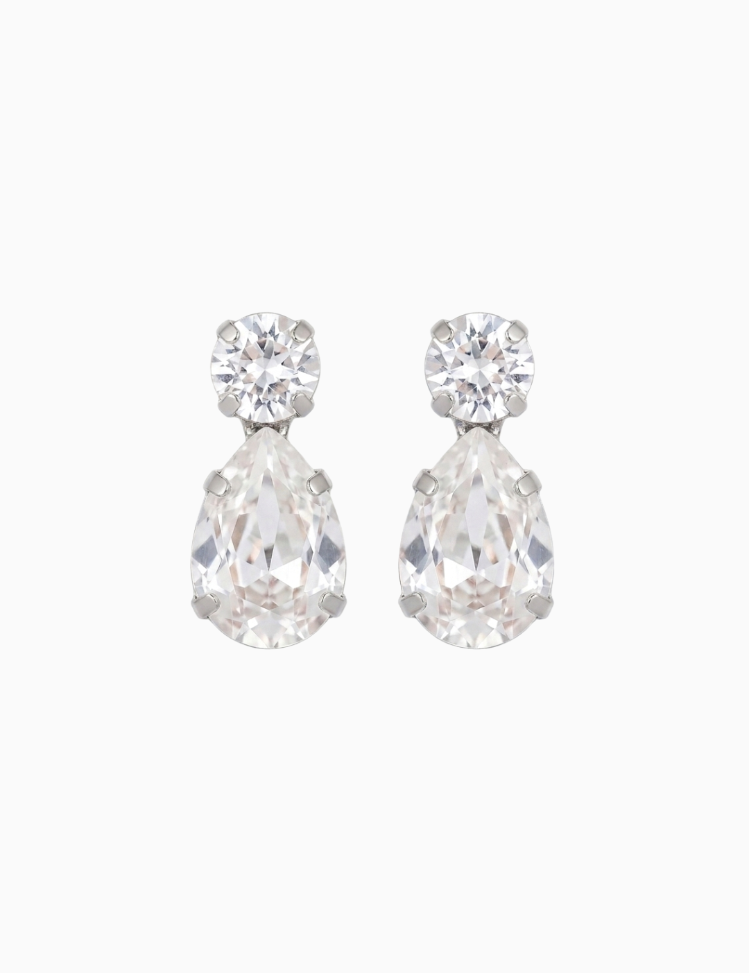 Pair of teardrop-shaped crystal earrings on a white background