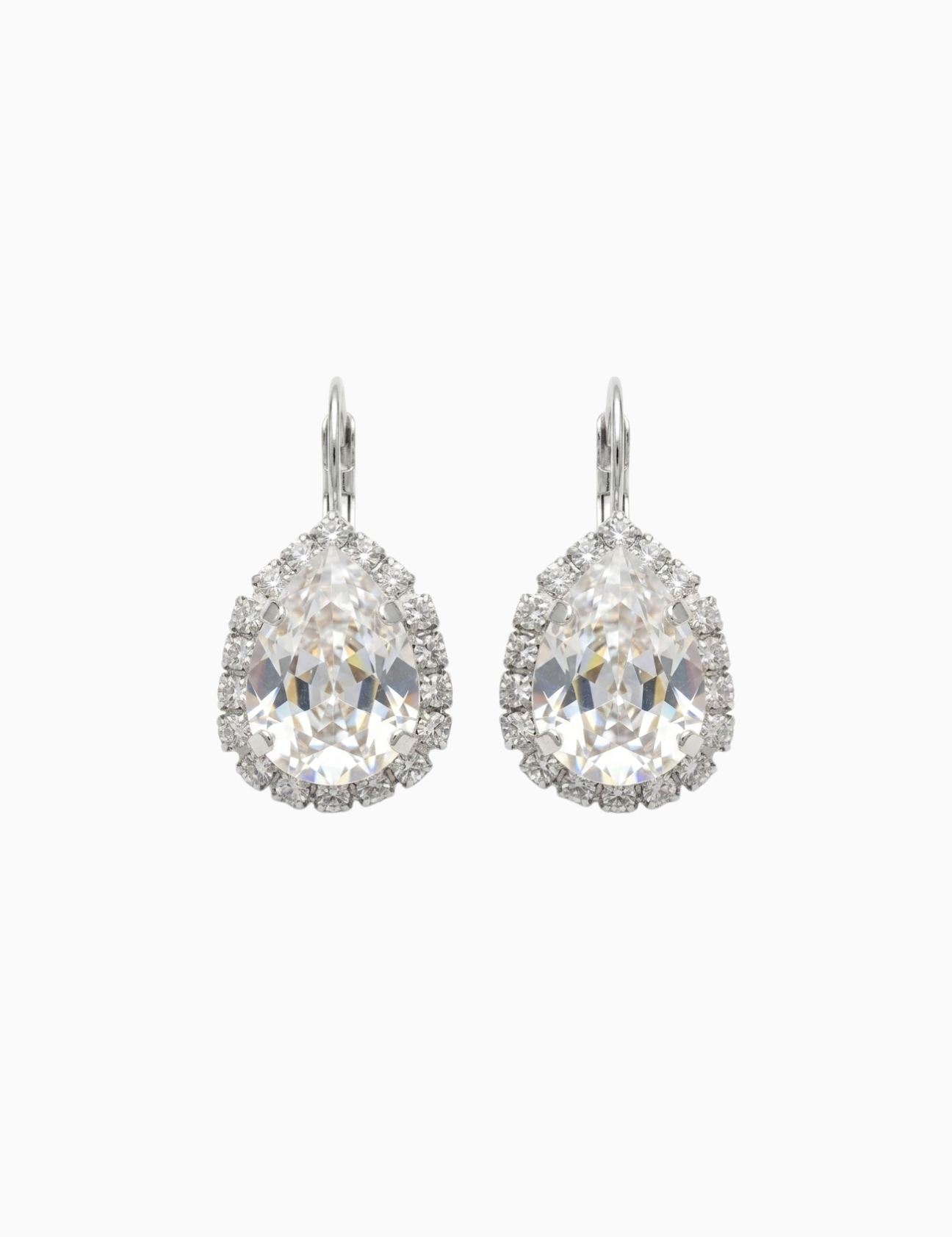Pair of silver earrings with clear gemstones on a white background


