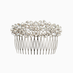 Silver hair comb with pearls and crystals on a white background