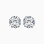 Pair of silver earrings with clear gemstones on a white background