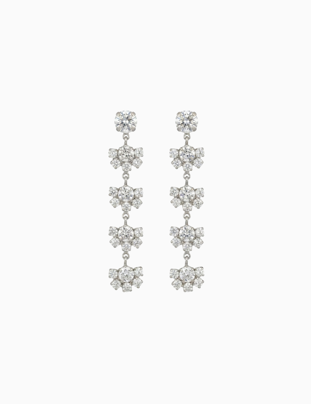 Pair of silver floral earrings on a white background