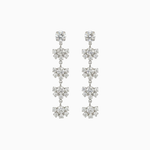 Pair of silver floral earrings on a white background