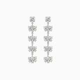 Pair of silver floral earrings on a white background