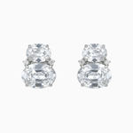 Pair of silver earrings with large clear gemstones on a white background