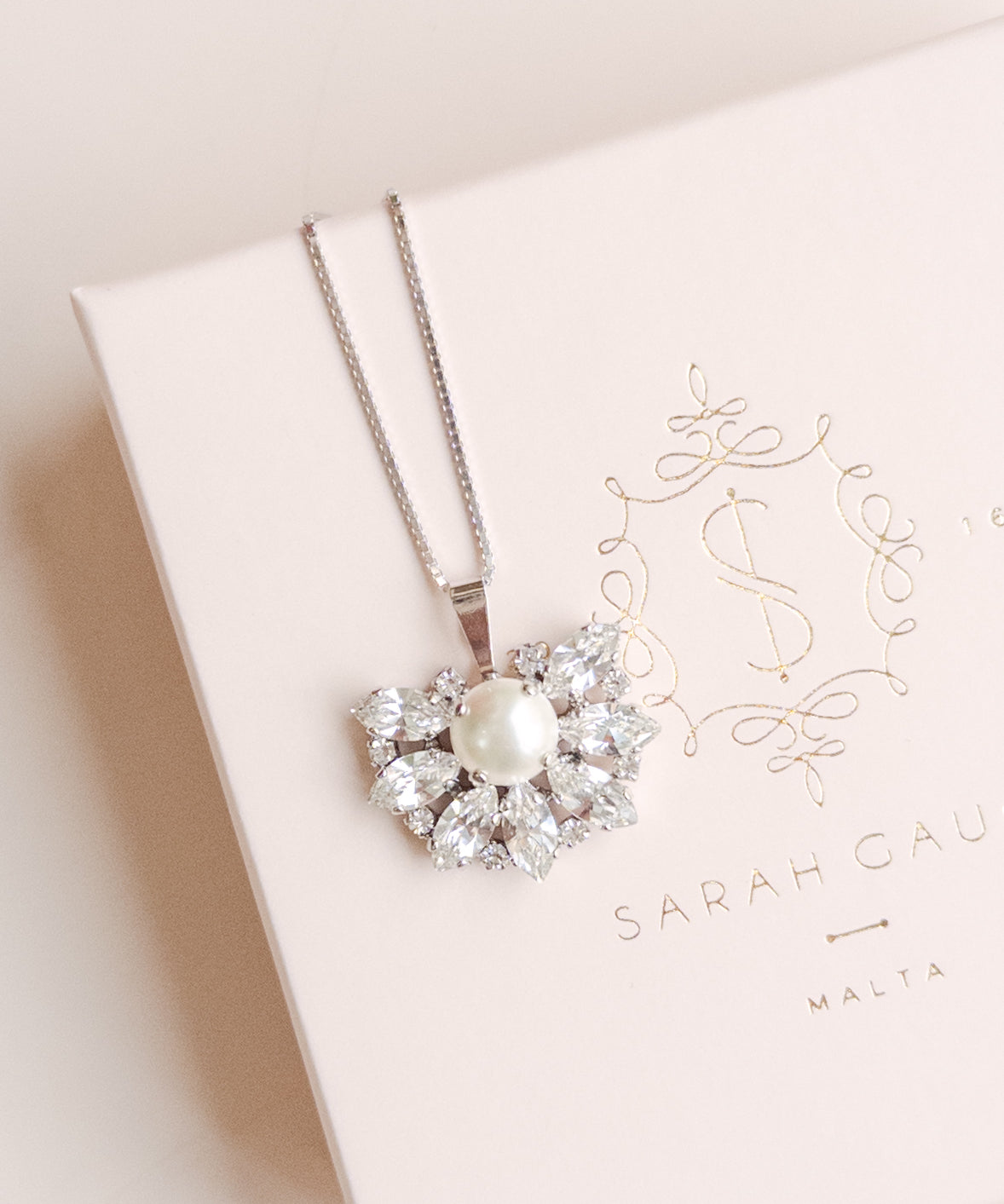 Pearl necklace on a Sarah Gauci branded box