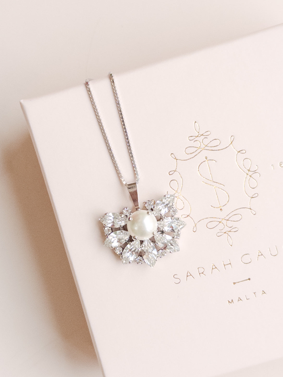 Pearl necklace on a Sarah Gauci branded box